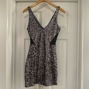 BEBE sequin mini dress with black mesh cutouts size XS